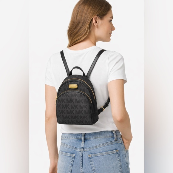 Michael Kors Handbags - Michael Kors Black and Gold Logo Backpack